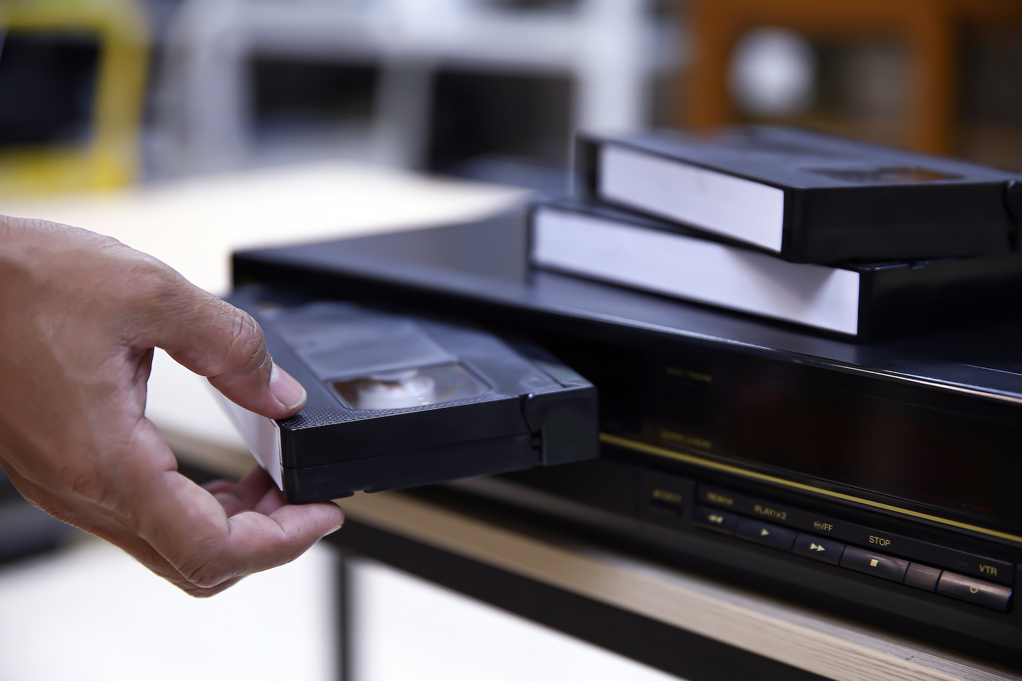 a VHS tape being loaded into a player